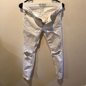 Ripped knee jeans by Free People